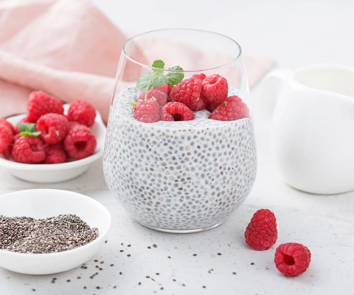 Wholesome chia pudding made with almond milk and topped with fresh raspberries and mint for a nutritious, balanced breakfast.