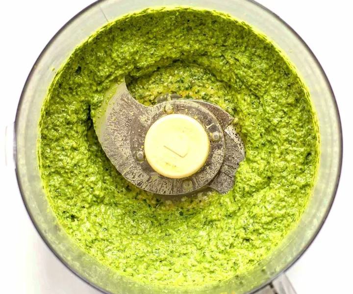 Bright, aromatic pesto sauce made from fresh basil, garlic, pine nuts, parmesan, and olive oil. Freshly blended in a food processor, perfect addition for pasta, salads, pizza or sandwiches.